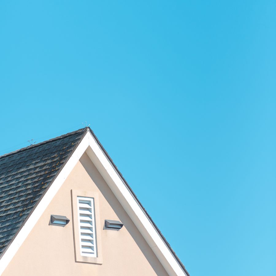 New shingle roof against a clear blue sky